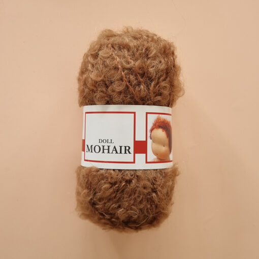 Mohair Boucle Yarn De Witte Engel used for crocheting and knitting curly doll hair & wigs in light brown shade.