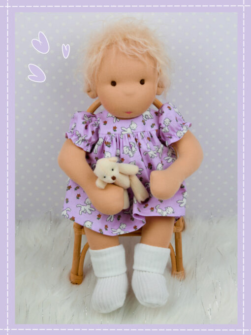 Baby Molly Doll Do Dah Waldorf Style Doll sitting in a chair.