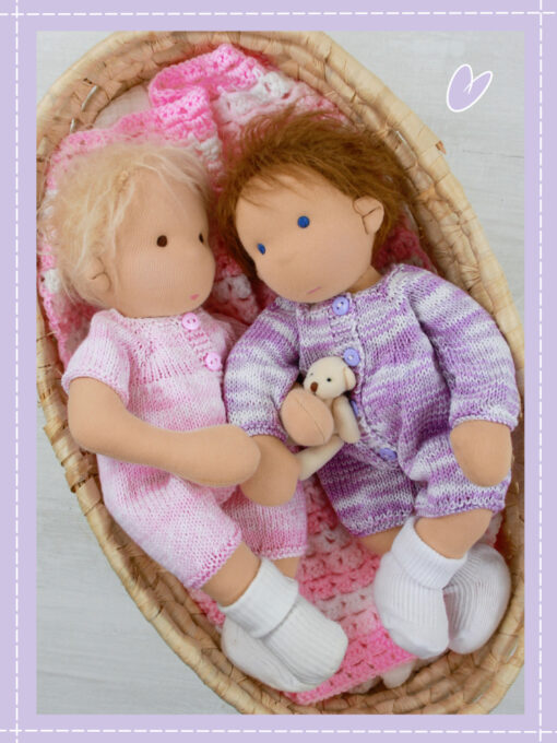 two Molly Dolly Doo Dah dolls lying in a crib together